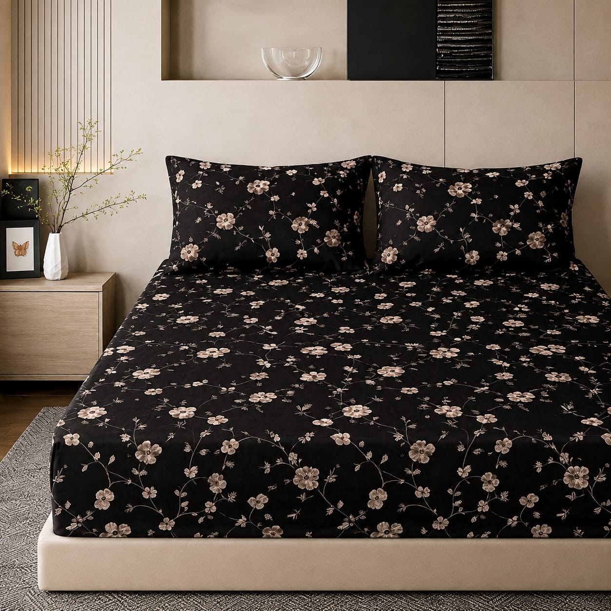 Mille Cart king size fitted bedsheet set in black with a delicate beige floral pattern and two matching pillow covers.